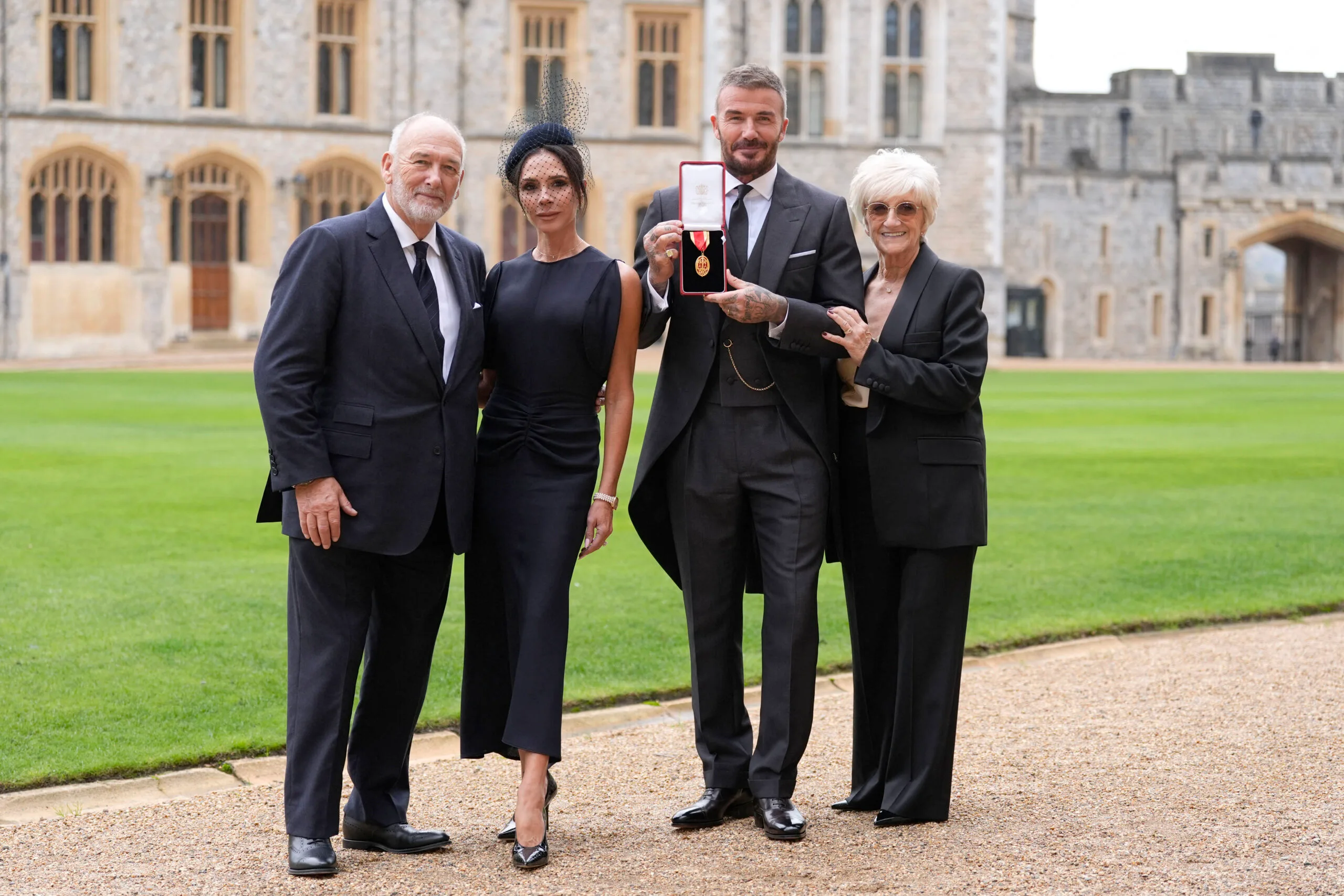 David Beckham knighted  and supported by Victoria Beckham and his parents Ted Beckham and Sandra West 