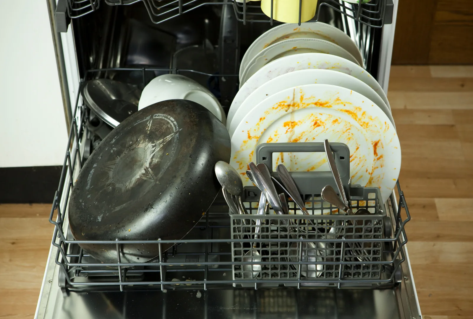 Dirty dishes in a dishwasher.