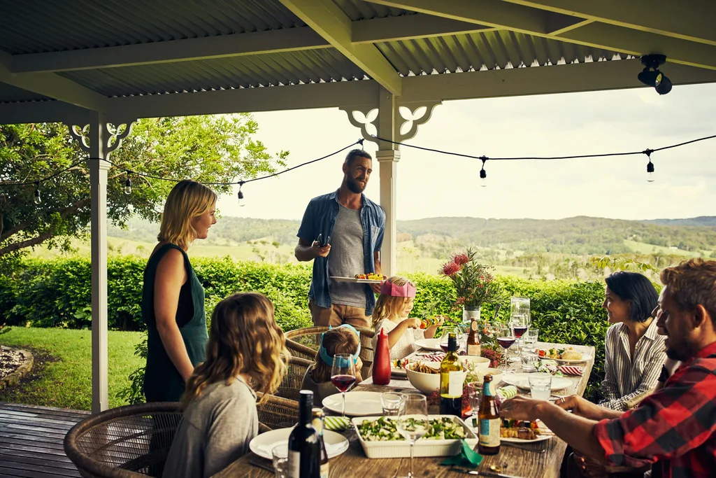 a group of people enjoying christmas lunch outdoors