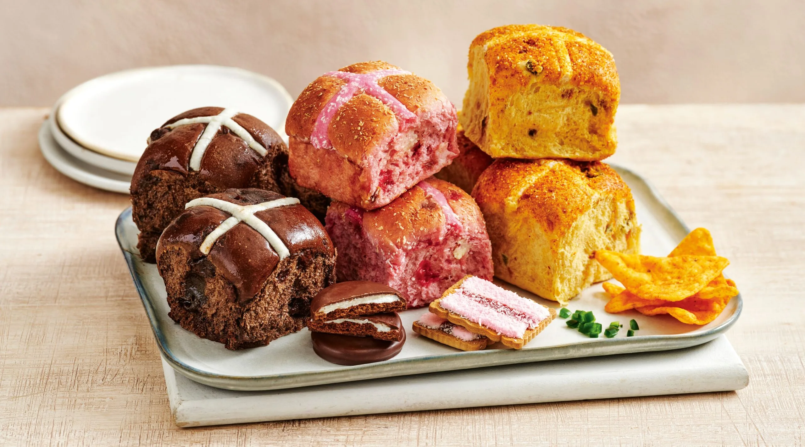 Coles' hot cross buns: Mint Slice, Iced VoVo, and Cheesy Jalapeno Doritos flavours.