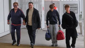 So grown up: Sir Elton John&rsquo;s teenage sons Zachary and Elijah make rare appearance