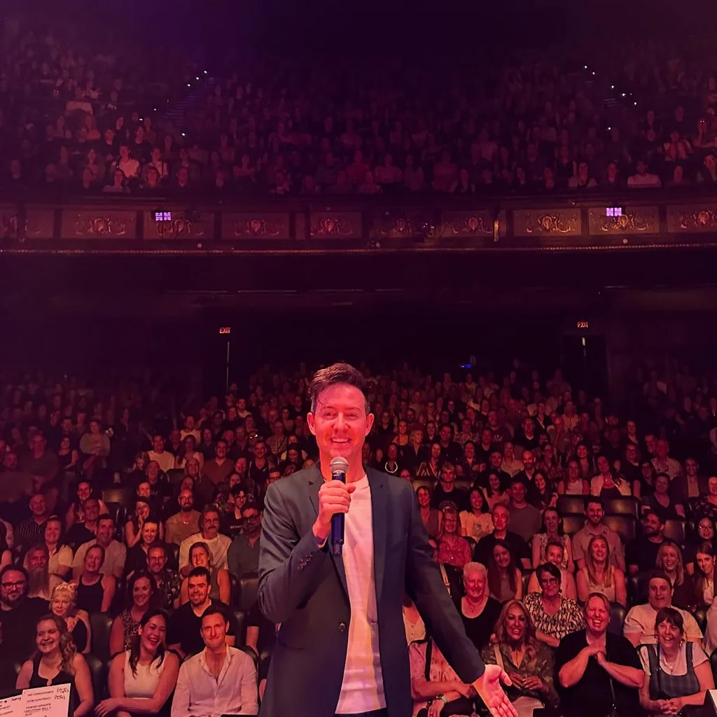 Nath Valvo doing stand-up comedy