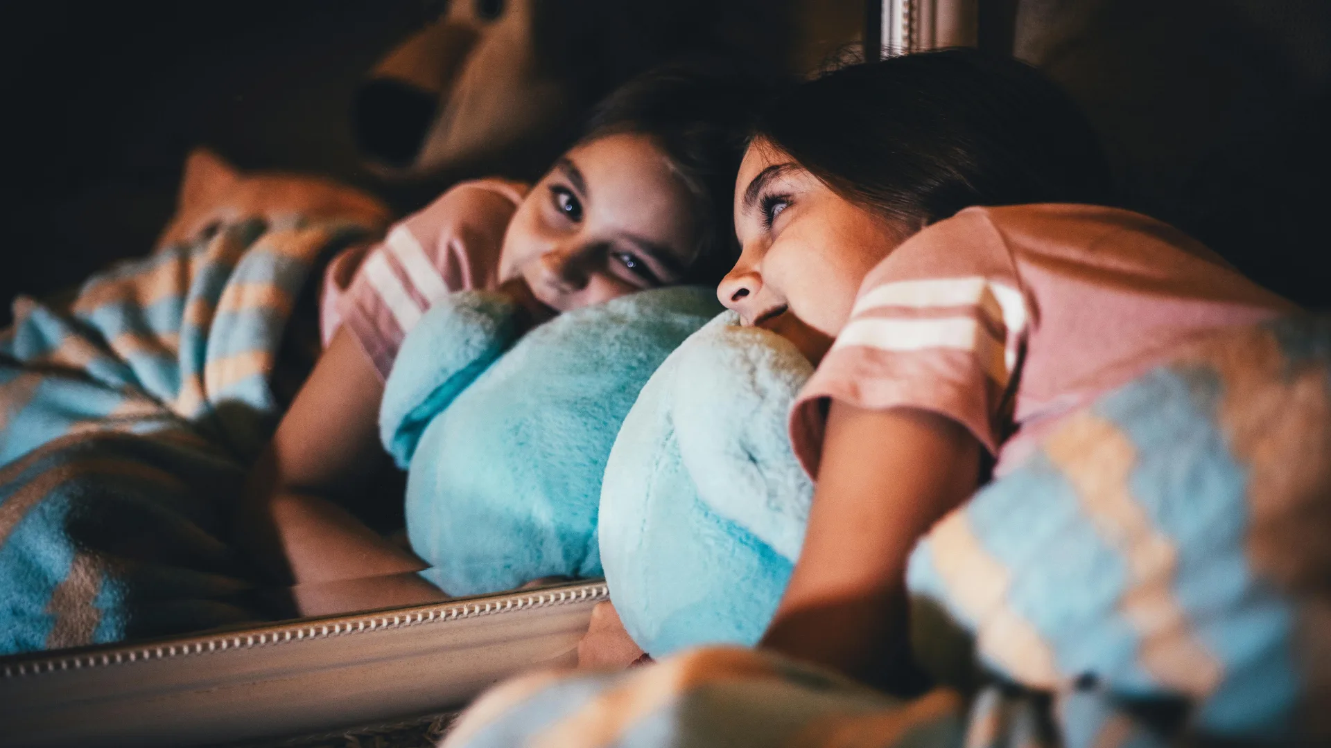 girl sleeping with stuffed toy