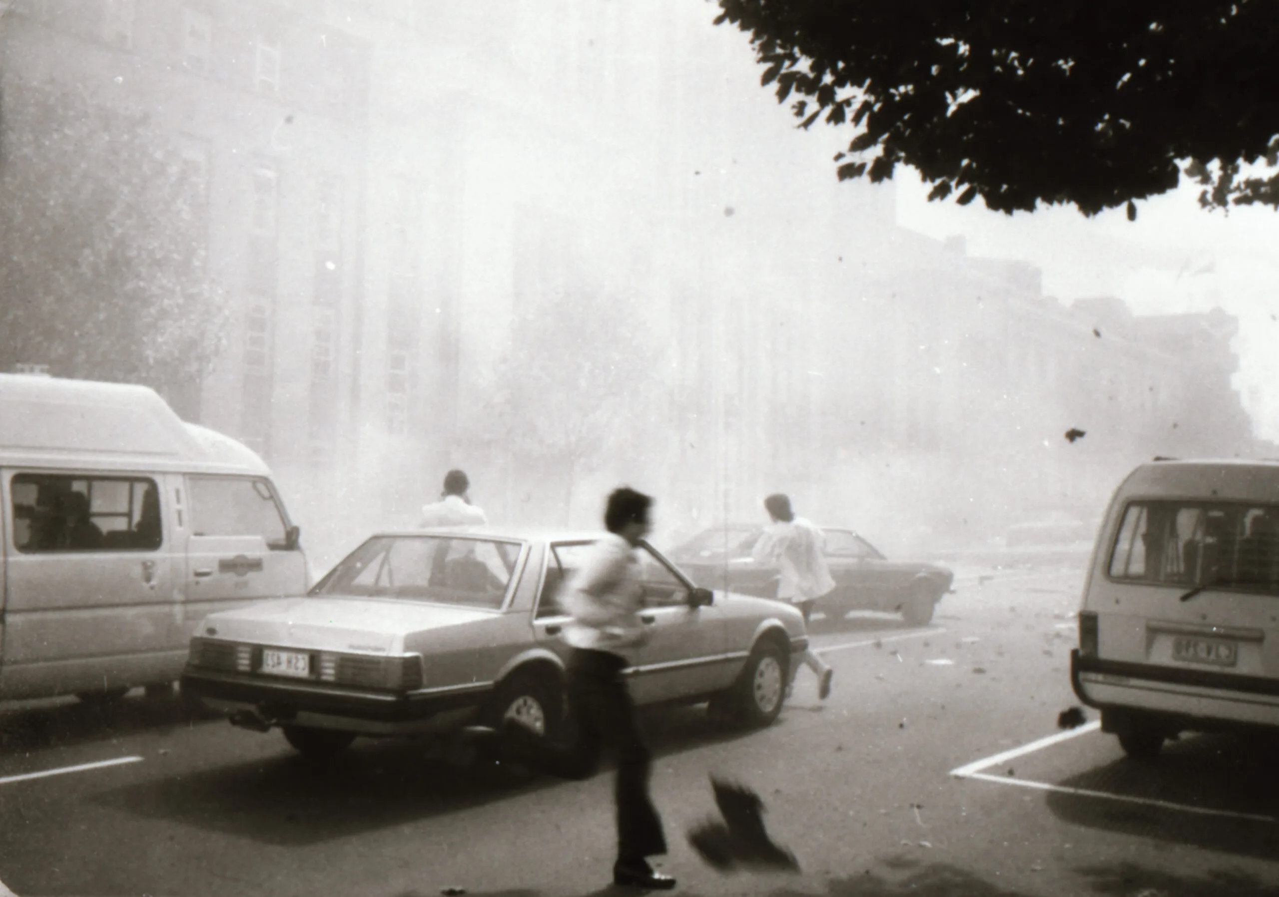Bystanders flee the car bomb outside Russell Street Police Station, March 1986.