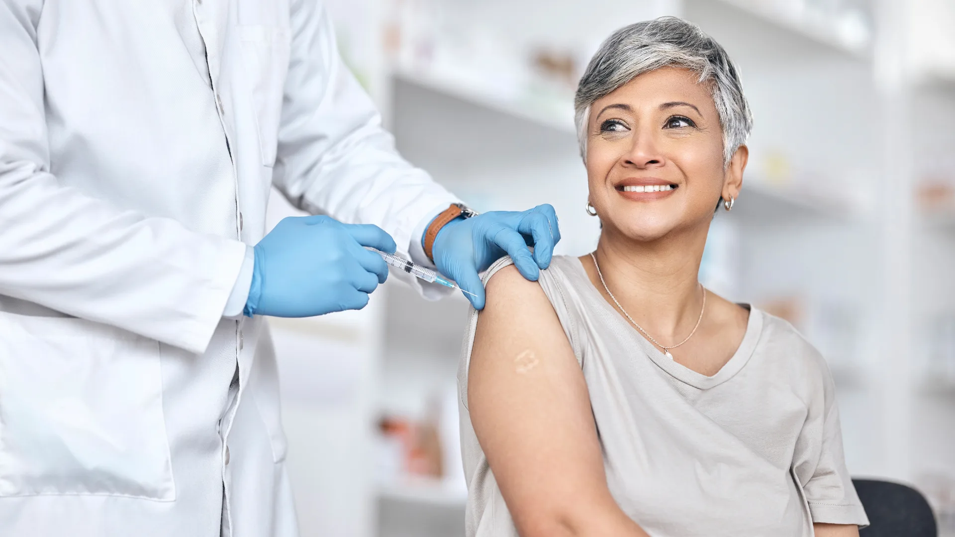older woman getting a flu shot