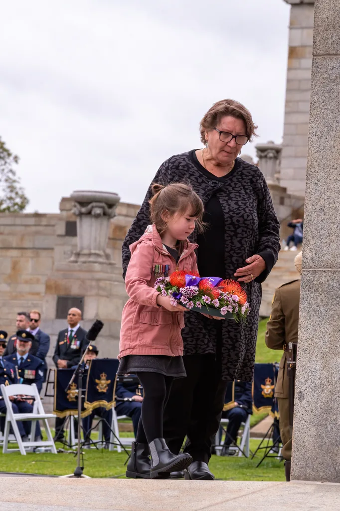 Annabelle ilson daughter Primrose wears her father's medals with pride