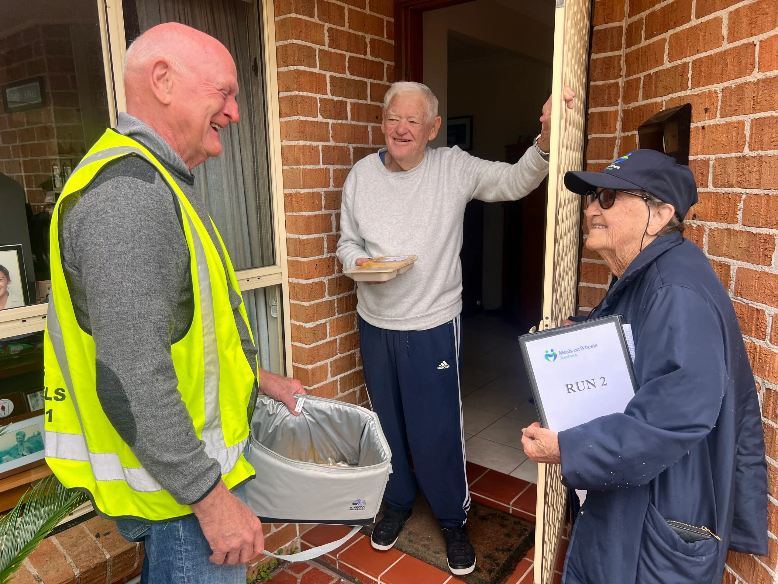 Pamela Doyle chat with clients when delivering meals