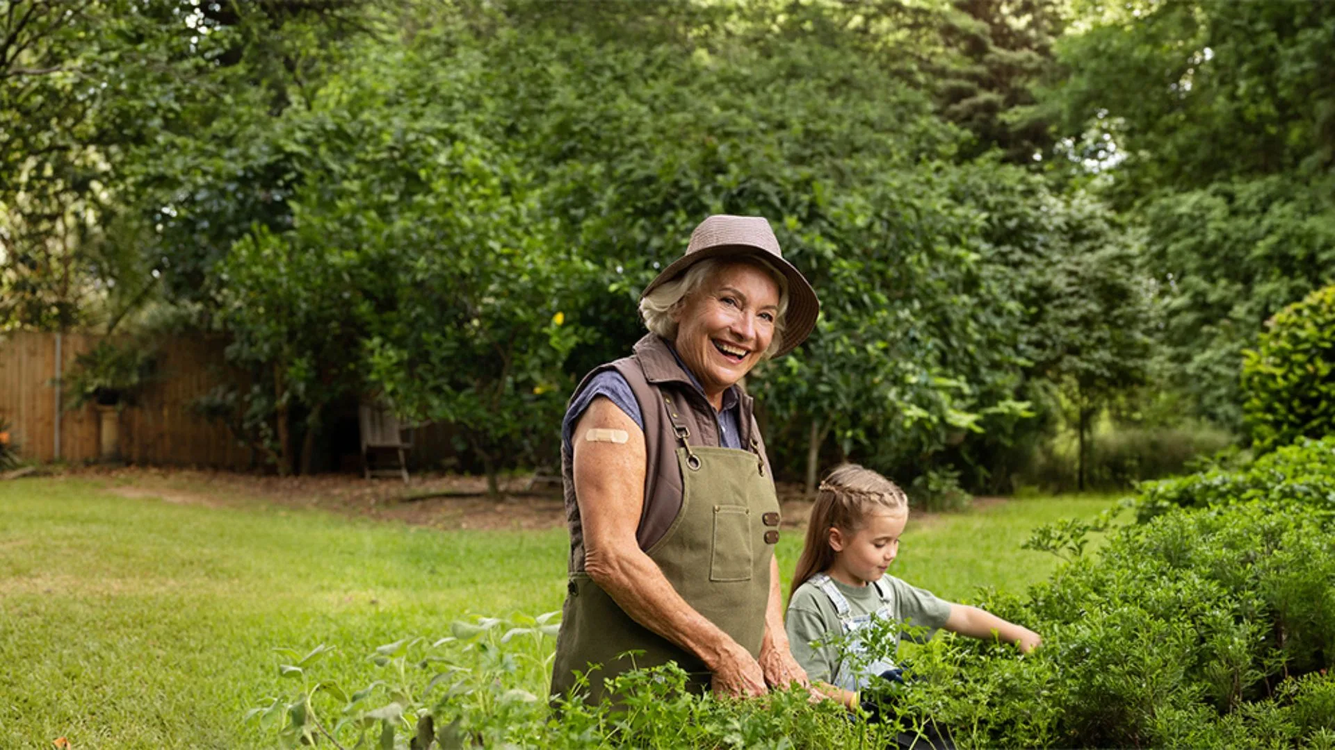 Grandmother with grand-daughter in garden