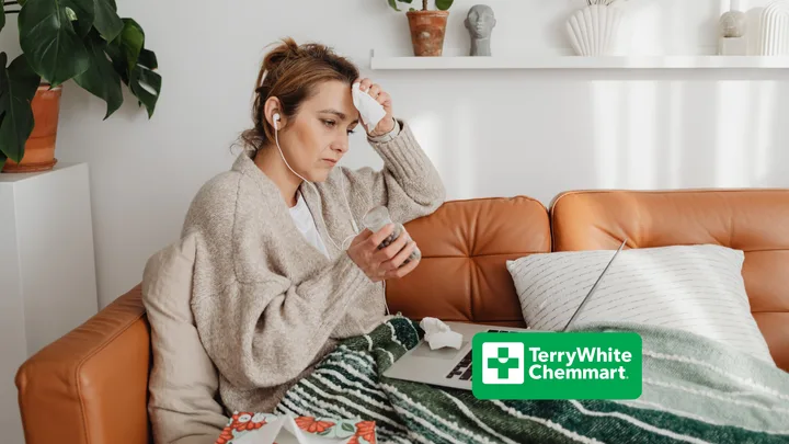 Woman sick on the couch