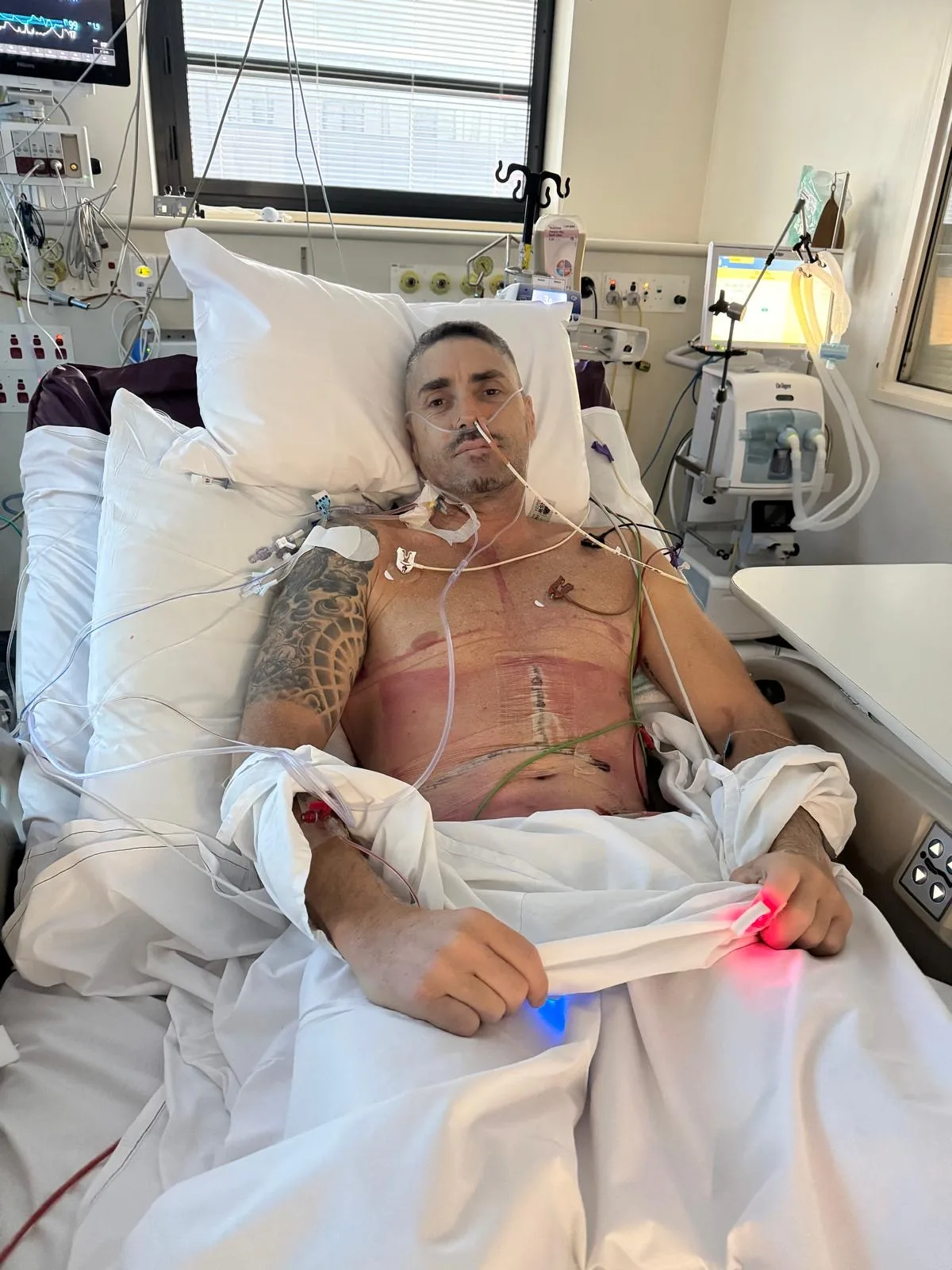 Bondi Rescue life guard Quinn Darragh in a hospital bed