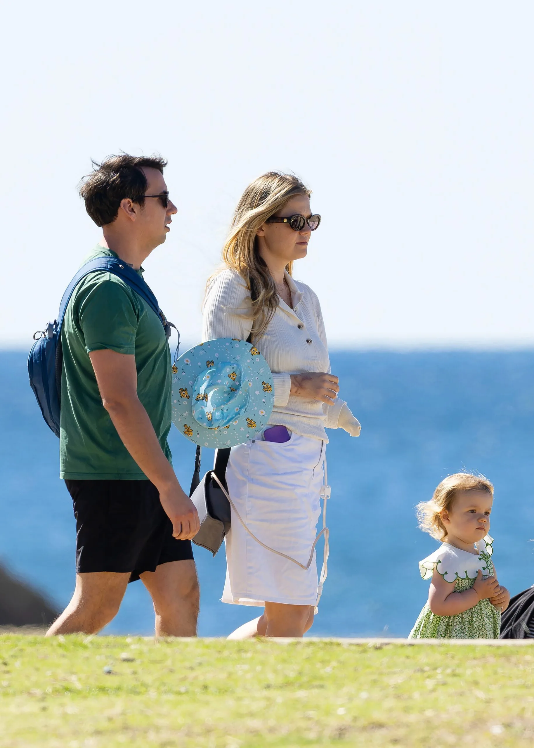 Leah Stewart walking with her family by the beach