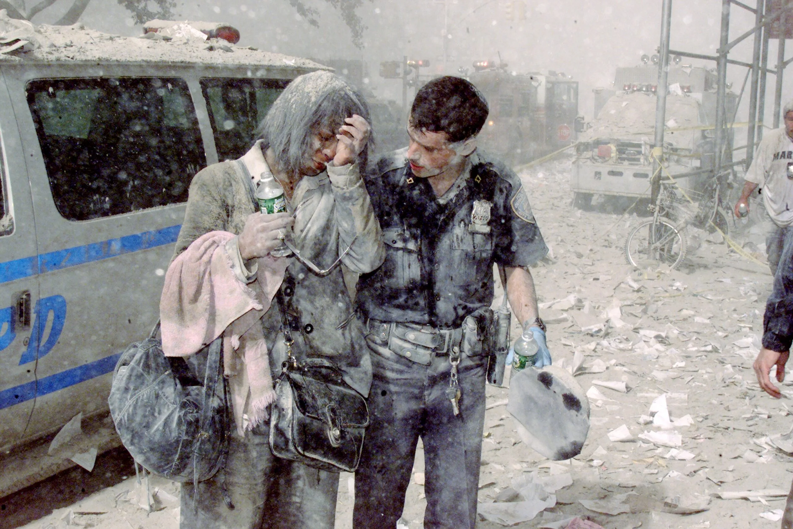 People covered in dust  on the streets of NYC on 9/11 