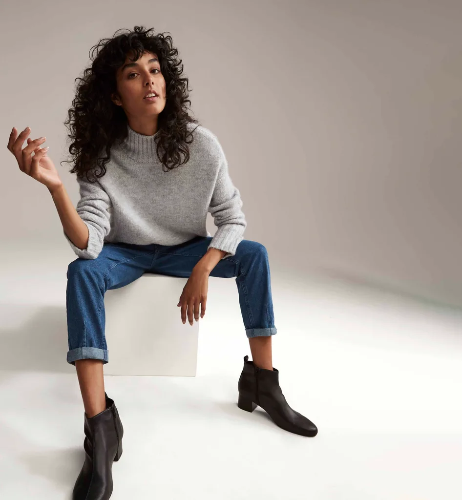 Women’s rib funnel neck, $25; Women’s flat front jeans, $20 at Kmart.