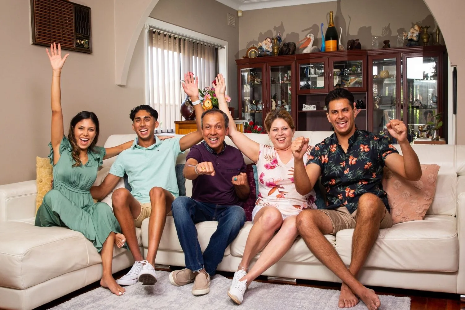 The Delpechitra family from Gogglebox poses on a couch together