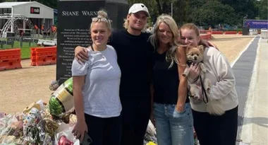 Simone Callahan and kids honour Shane Warne as they visit his statue