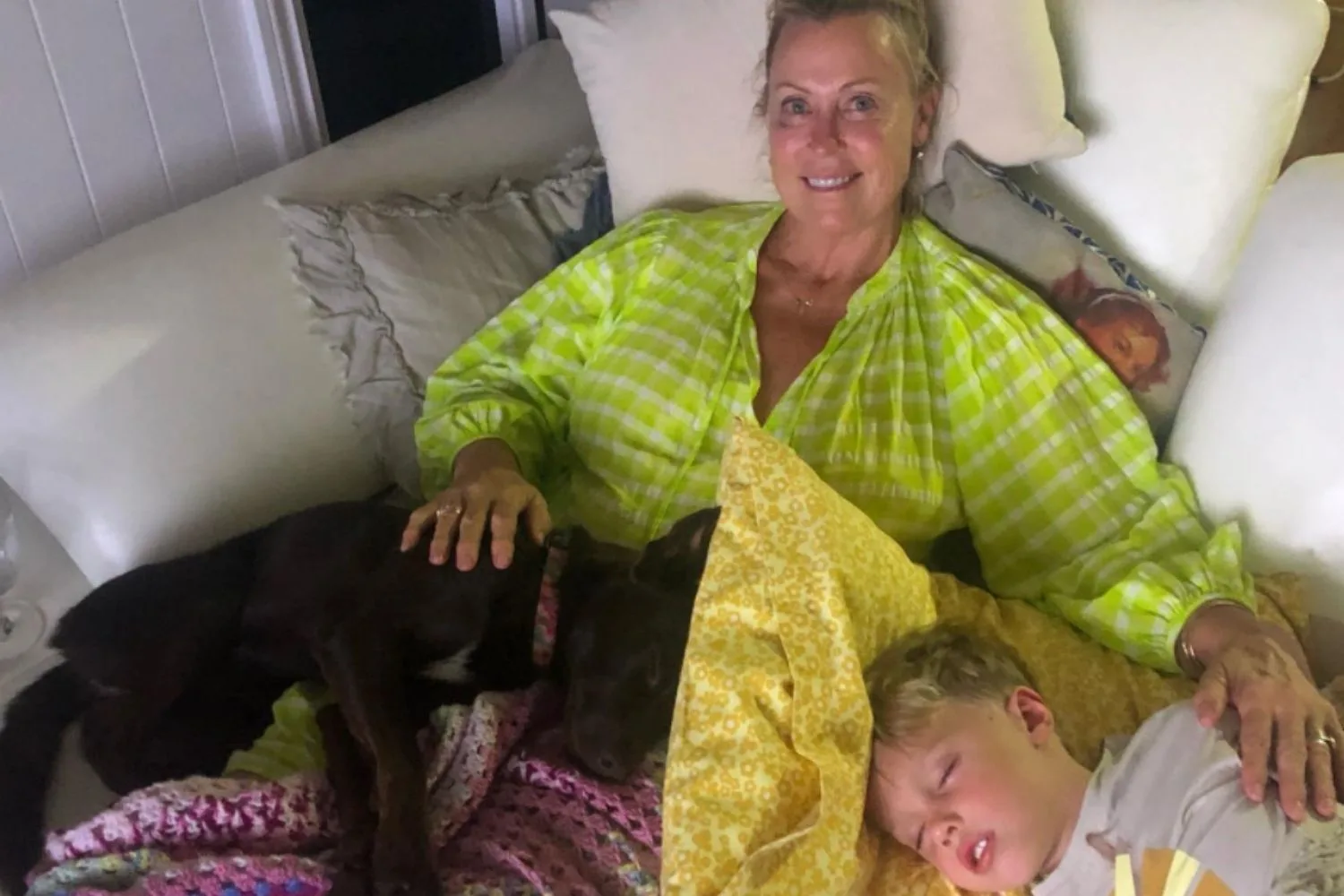 lisa curry with her sleeping grandchildren