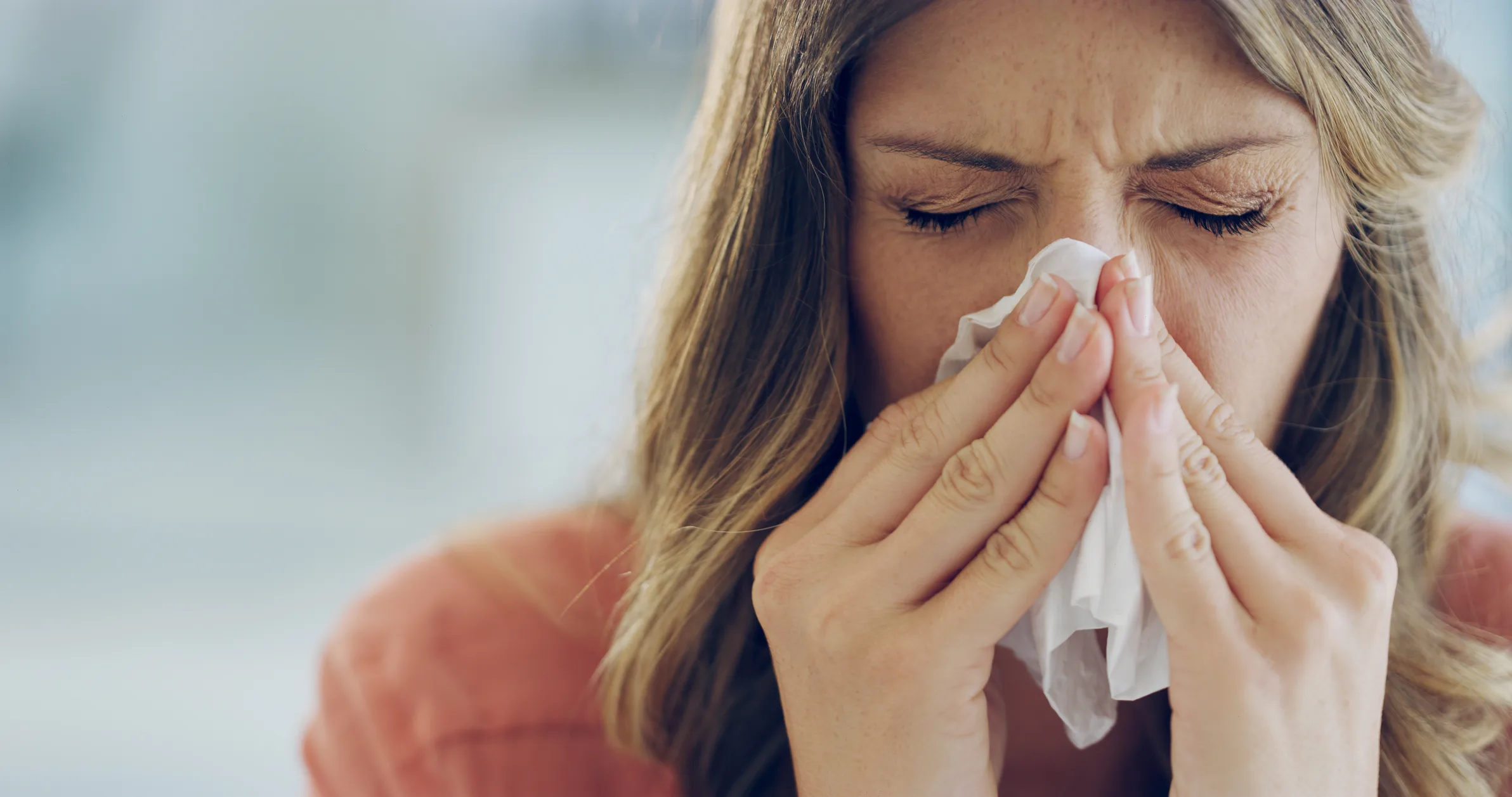 woman-sneezing