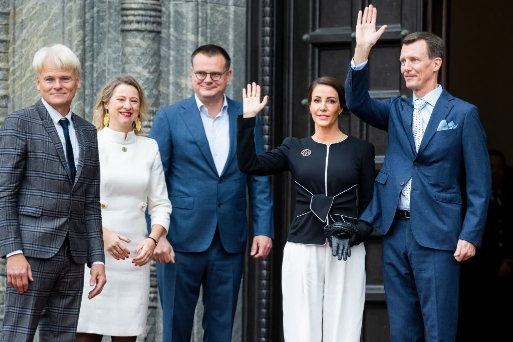 Denmark's Crown Prince Frederik (2ndR) and Crown Princess Mary (R) arrive at Copenhagen City Hall