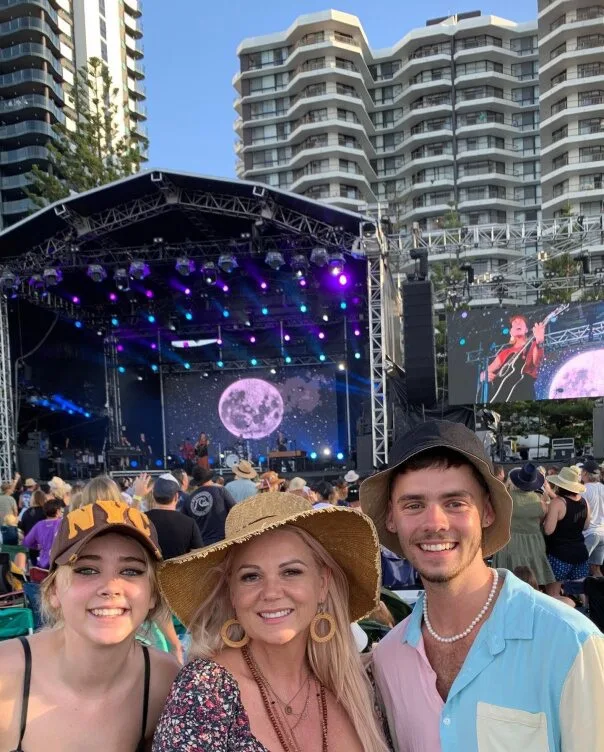 A woman and children at a music festival