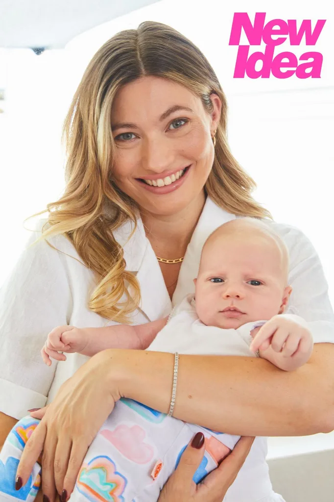 Survivor star Shonee holding her baby