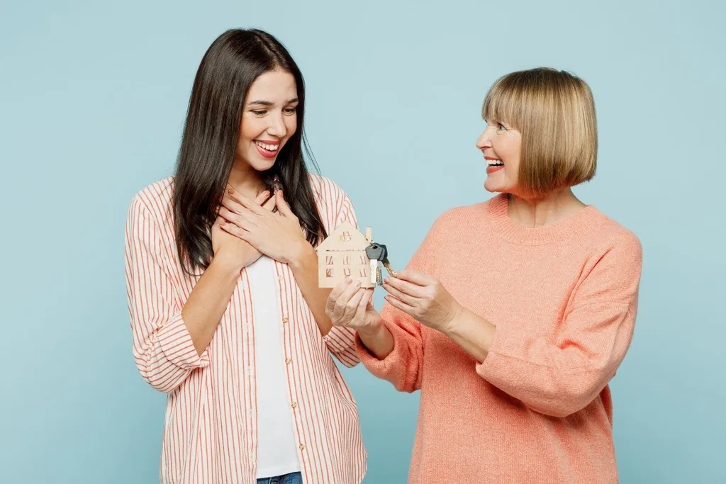 image of mother giving a key to her daughter