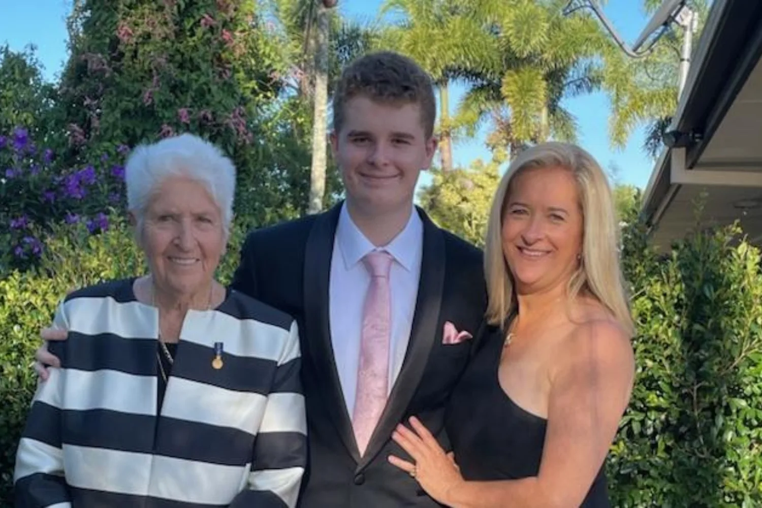 Dawn Fraser standing outside with her grandson Jackson and daughter Dawn-Lorraine.