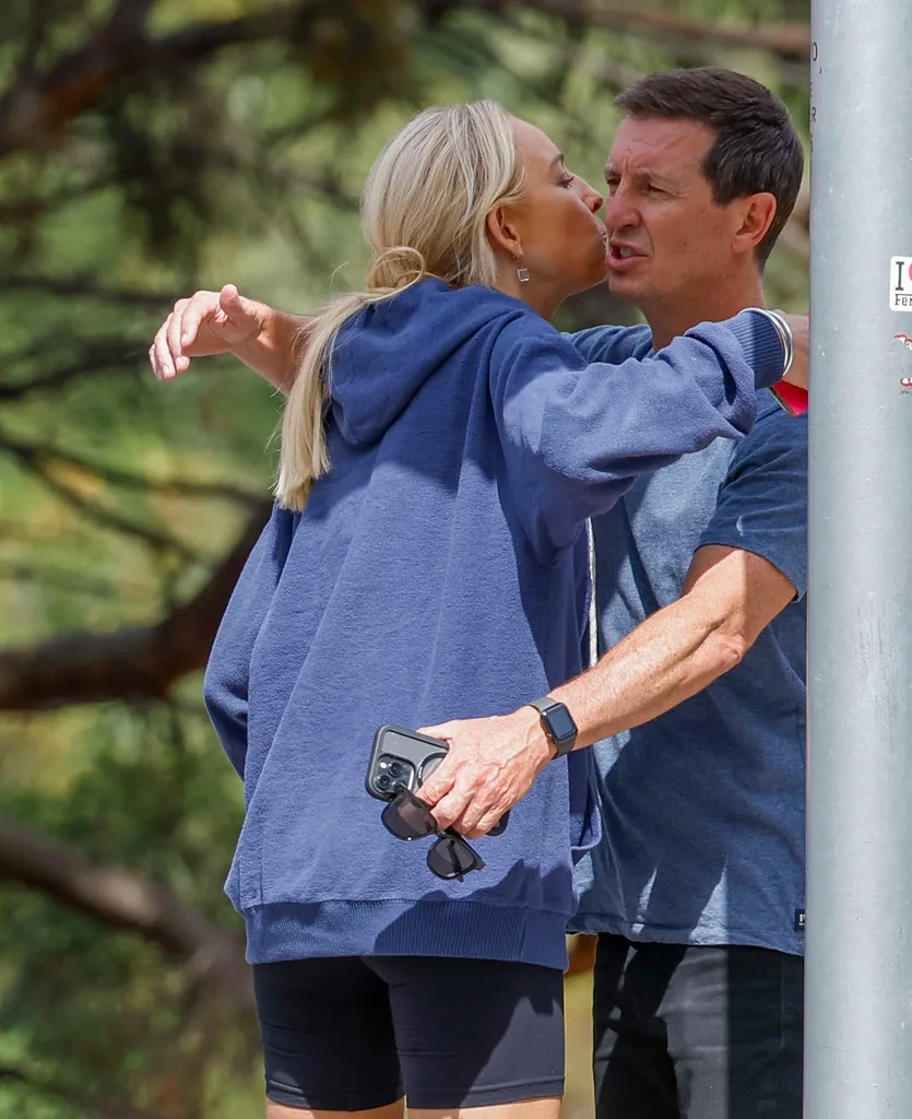 Carrie Bickmore hugs Rove McManus.
