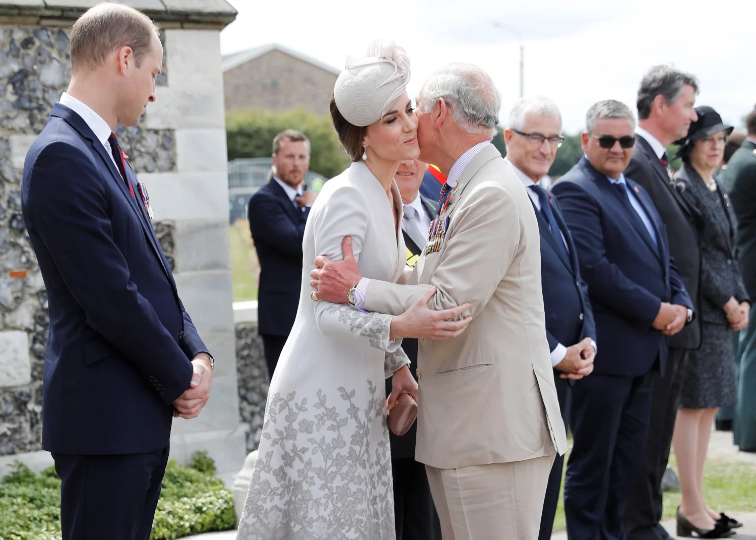 King Charles kisses Catherine, Princess of Wales on cheek