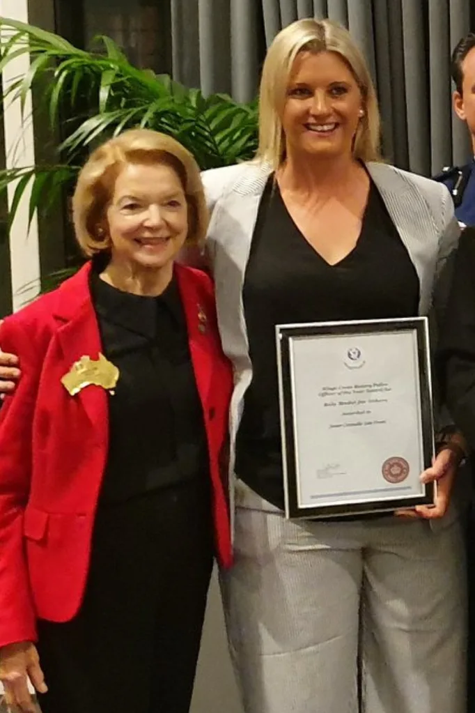 Bondi shooting her police officer Amy Scott receiving an award.