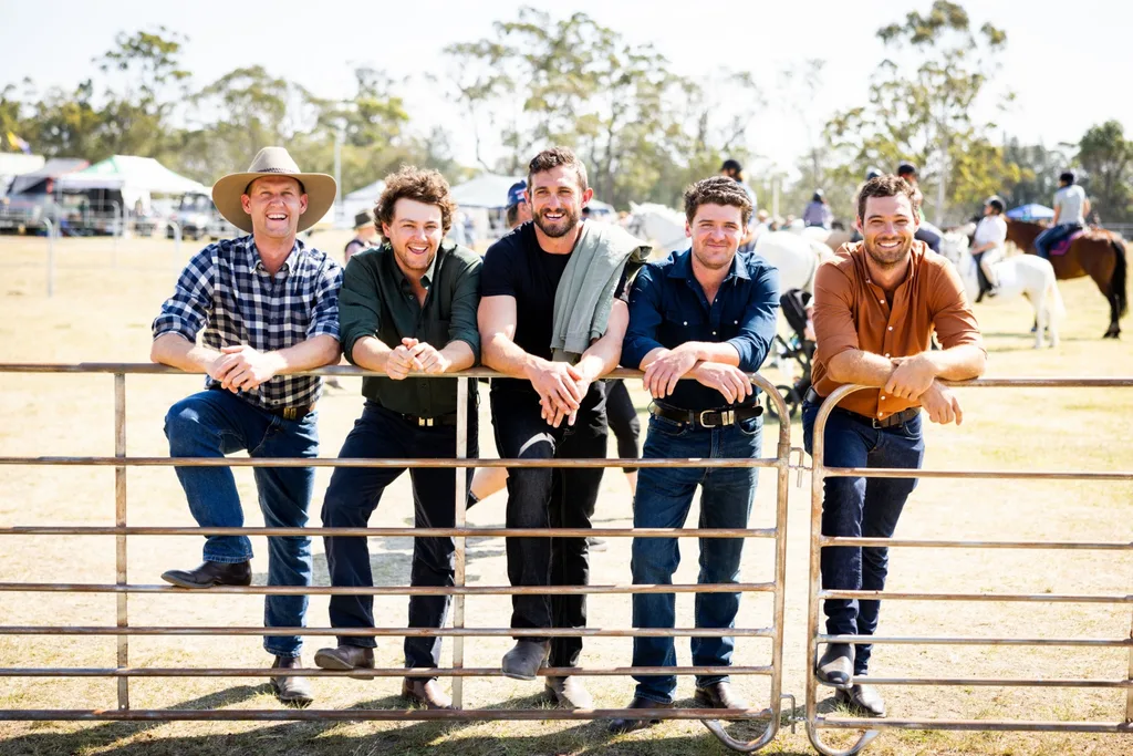 Five male farmers standing in a paddock