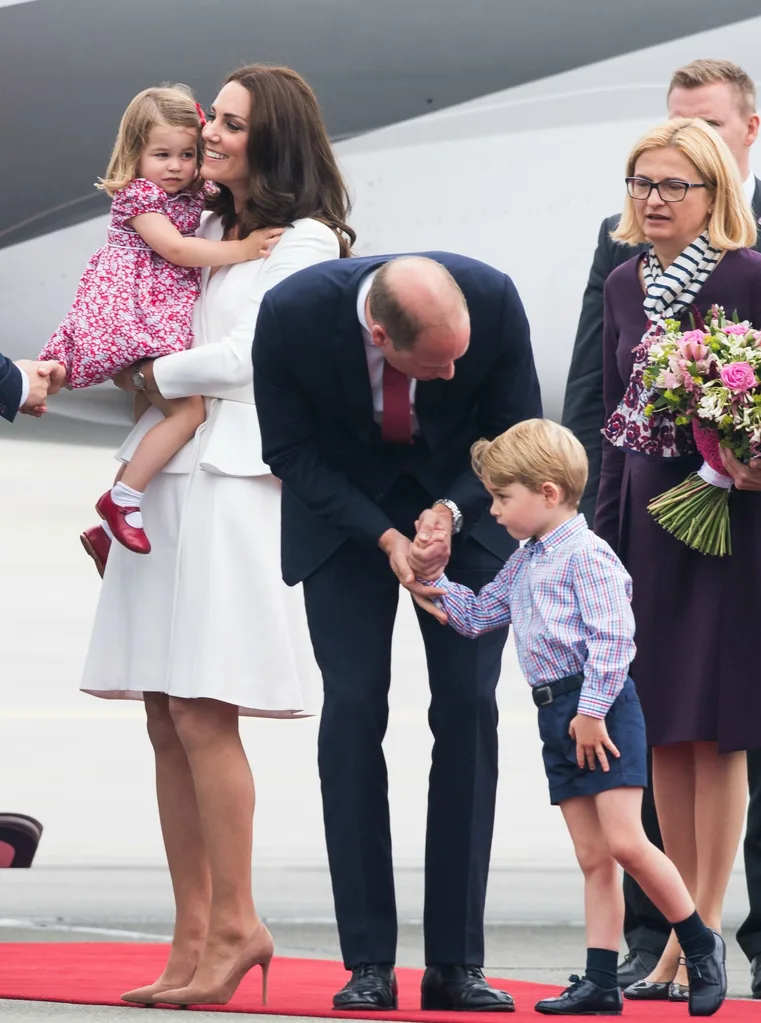 Royal family getting off plane in Poland