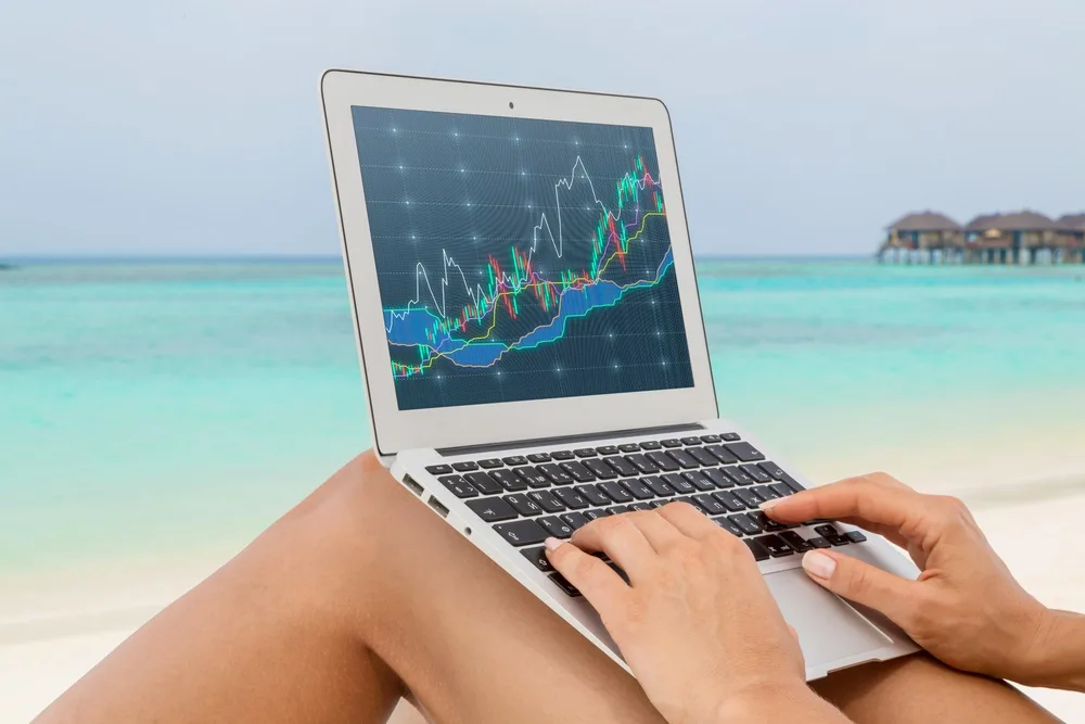 Working on beach with laptop