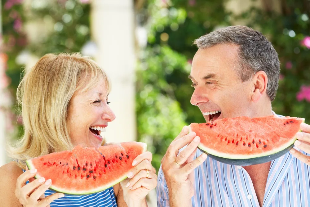 Couple eating watermelon