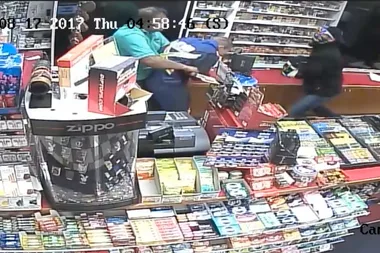 The incredible moment this store clerk fights off armed robbers
