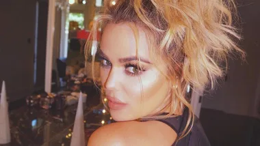 Pregnant Khloe Kardashian poses in a crop-top on social media