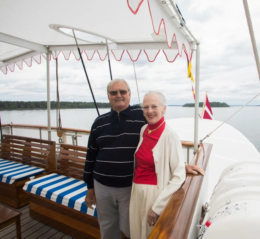PHOTO: ERIK CHRISTENSEN, PORKERI (CC BY-SA 3.0) VIA WIKIMEDIA COMMONS It was announced by the Royal Danish House today that His Royal Highness Prince Henrik of Denmark has died at the age of 83. He was the husband of Queen Margrethe and father to Crown Prince Frederik and Prince Joachim. The Royal Danish House said in a statement, “His Royal Highness Prince Henrik died on Tuesday, February 13, at. 23.18 peacefully in his sleep at Fredensborg Palace. “The Prince was surrounded by Her Majesty The Queen and their two sons.” He is survived by his wife of 50 years, Queen Margrethe; son and daughter-in-law, Crown Prince Frederik and Crown Princess Mary; son and daughter-in-law, Prince Joachim and Princess Marie; grandchildren, Prince Nikolai, Prince Felix, Prince Christian, Princess Isabella, Prince Henrik, Prince Vincent, Princess Josephine and Princess Athena, as well as several nieces and nephews. The Prince has been in ill health for some time with several hospitalisations in recent years. On 6 September 2017, it was announced that he had been diagnosed with dementia after a series of examinations. Just earlier this year, His Royal Highness was hospitalised in Egypt for a few days before returning to Denmark and being admitted to Copenhagen’s Rigshospitalet for further tests. It was determined a few days later that the Prince had a benign tumour on his left lung. He was transferred to the infectious department from the lung surgery department at the hospital for treatment. It was also announced upon his release from hospital he would take up residence at Fredensborg Palace; Queen Margrethe was to take up residence there, as well, to be near her ill husband. On 9 February, the Royal House announced that His Royal Highness’s condition had worsened considerably; Crown Prince Frederik, who was in South Korea as part of his role as a member of the International Olympic Committee, was called home two weeks ahead of schedule. Several members of the Danish Royal Family visited Henrik in hospital on the day of the announcement, as well. Prince Henrik, sitting to the right, in an official photo for his grandson, Prince Felix’s confirmation in 2017. © Steen Brogaard, Kongehuset Henri Marie Jean André de Laborde de Monpezat was born on 11 June 1934 in Talence, Gironde, France, to Count André de Laborde de Monpezat and Countess Renée de Monpezat, née Doursennot. Henri, as he was then known, spent his first five years in Vietnam while his father was employed there. He was educated privately at home until 1947 before enrolling at the Jesuit boarding school in Bordeaux. Henri would attend upper secondary school in Cahors, France, and would later graduate from the French upper secondary school in Hanoi, Vietnam. For his university studies, he studied law and political science at the Sorbonne in Paris while also focusing on Chinese and Vietnamese at École Nationale des Langues Orientales. He served in the French Army during the Algerian War and worked in the French Foreign Affairs ministry. A lover of poetry, the Prince has had several of his works published in French, Greenlandic and Danish as well as other memoirs and a recipe book. The polyglot, who spoke his native French, Danish, English, Chinese and Vietnamese, married Princess Margrethe of Denmark (heir apparent to the Danish throne) on 10 June 1967. He converted from Roman Catholicism to Lutheranism and changed his name to the Danish form “Henrik.” Upon his marriage, he became His Royal Highness Prince Henrik of Denmark. Queen Margrethe and Prince Henrik onboard the royal yacht to celebrate their golden wedding anniversary in 2017.