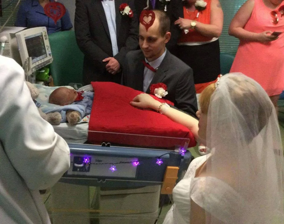Pictured: Heartbreaking moment parents wed at their dying baby’s bedside