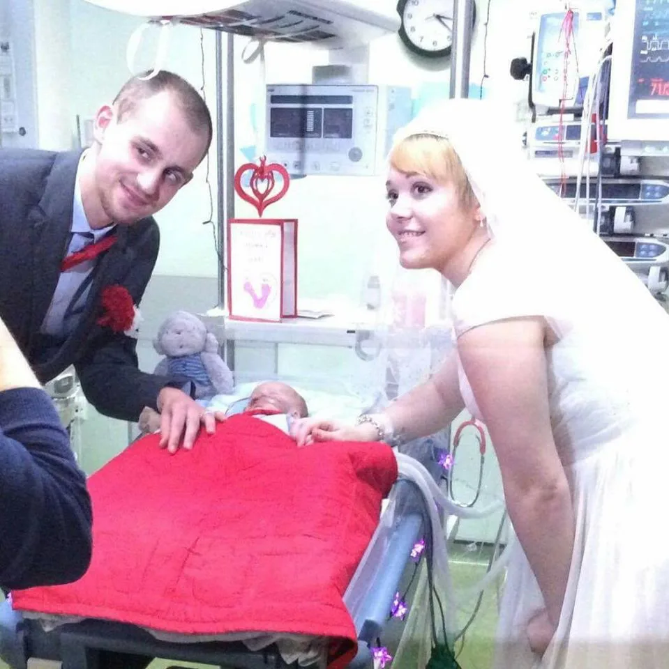 Pictured: Heartbreaking moment parents wed at their dying baby’s bedside