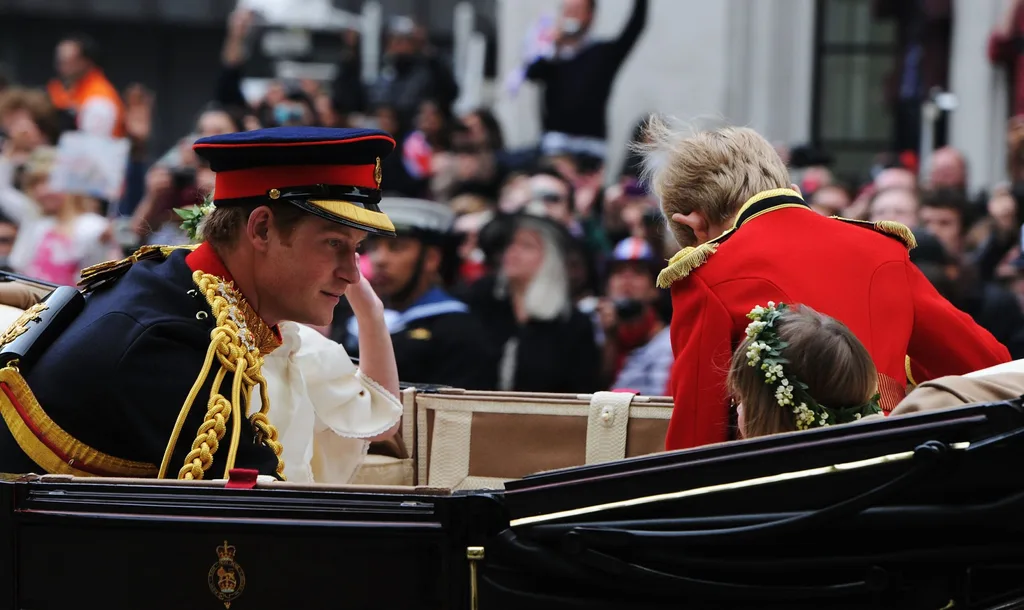 Prince Harry rides in an Ascot Landau at his brother's wedding