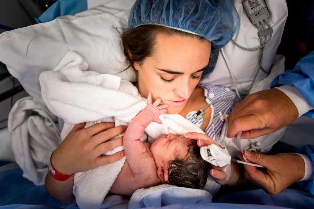 Pictured: The moment C-section baby reaches out to touch her mother’s face