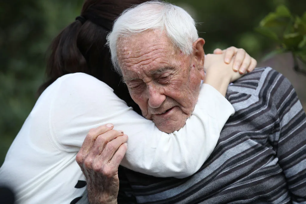 A hug before he ends his life: 104-year old academic who will die in assisted suicide