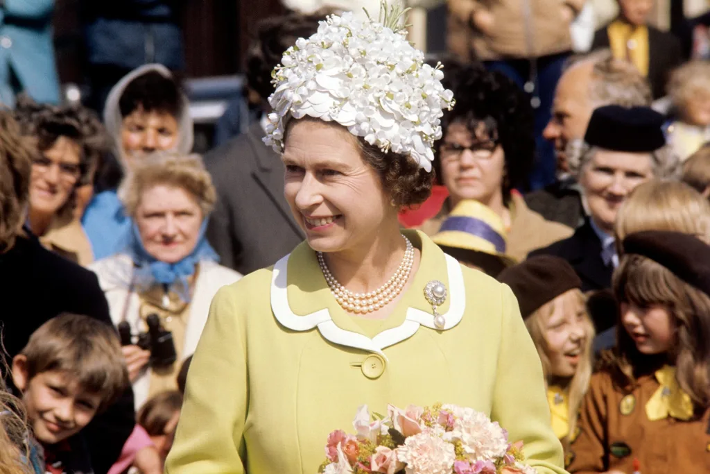 The Queen in a white floral headpiece during her visit to the Isle of Man in 1972