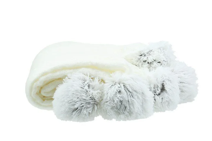 House & Home pom pom throw in Cloud Dancer, $19, Big W.