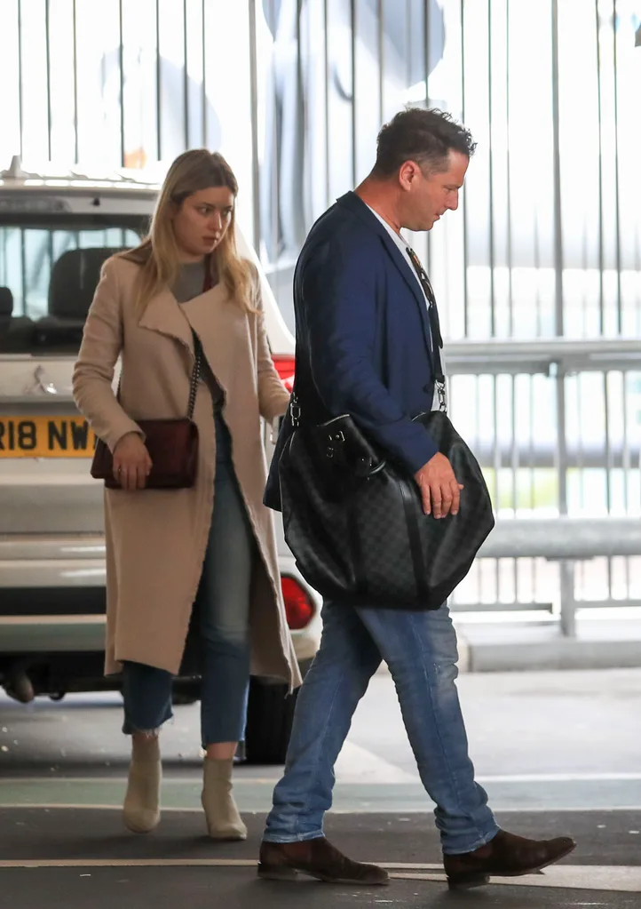 Karl Stefanovic looks crumpled and glum as he arrives in London for the Royal wedding