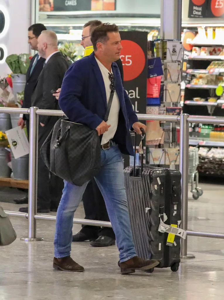 Karl Stefanovic looks crumpled and glum as he arrives in London for the Royal wedding