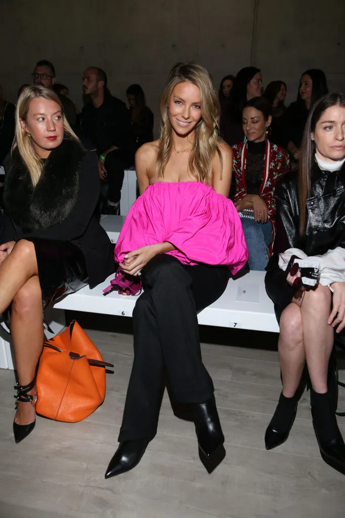 Jennifer appeared to catch the attention of her neighbour on the front row