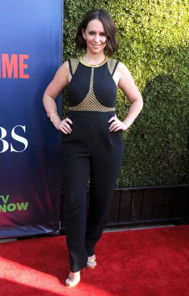 Jennifer ditches dresses for a black and gold jumpsuit in 2014