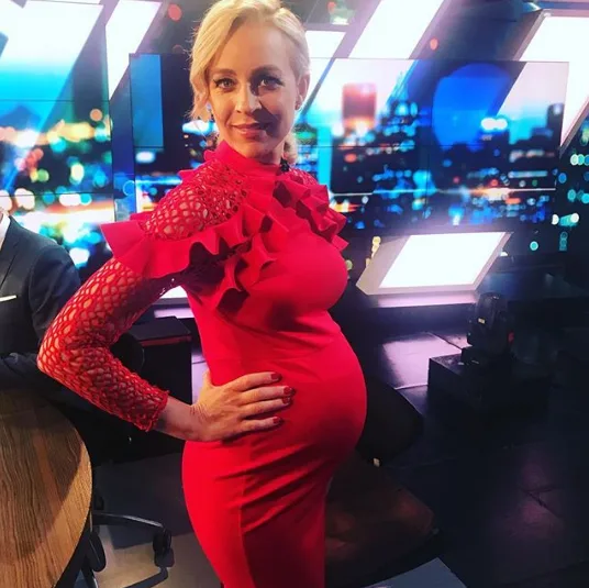 Pregnant Carrie Bickmore cheers on son at football