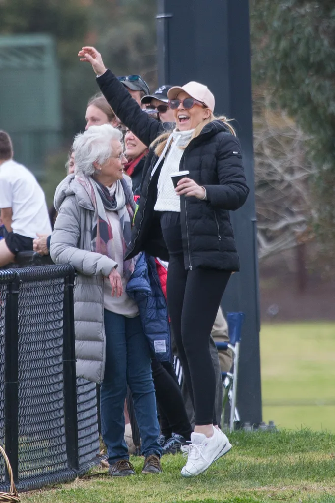 Pregnant Carrie Bickmore cheers on son at football