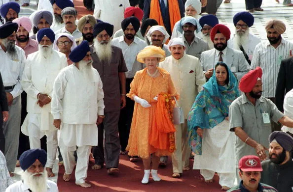 The Queen wears orange to church service